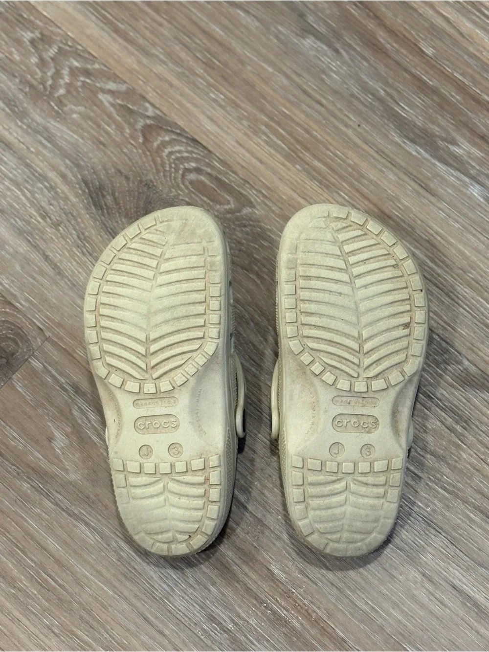 Kids size 3 cream crocs.